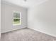 Bedroom featuring carpeted floors, white walls, and a window with blinds at 565 Kent Rd., Georgetown, SC 29440