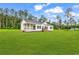 Charming single-story home with a covered porch and a large, well-manicured lawn at 565 Kent Rd., Georgetown, SC 29440