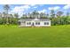 Charming single-story home with a covered porch and a large, well-manicured lawn at 565 Kent Rd., Georgetown, SC 29440