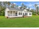 Charming single-story home with a covered porch and a large, well-manicured lawn at 565 Kent Rd., Georgetown, SC 29440