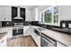 Bright kitchen featuring stainless steel appliances, black backsplash, and stylish window at 565 Kent Rd., Georgetown, SC 29440