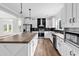 Bright kitchen featuring white cabinets, stainless steel appliances, and stylish pendant lighting at 565 Kent Rd., Georgetown, SC 29440