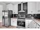 Bright kitchen featuring stainless steel appliances, black backsplash, and white cabinets at 565 Kent Rd., Georgetown, SC 29440