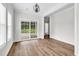Bright living room with wood-look floors and sliding glass door to the back patio at 565 Kent Rd., Georgetown, SC 29440
