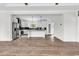 Open floor plan shows kitchen from living room with recessed lighting, neutral paint, and wood-look flooring at 565 Kent Rd., Georgetown, SC 29440