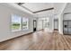 Bright living room, recessed lighting, neutral paint, wood-look flooring, and access to outdoor deck at 565 Kent Rd., Georgetown, SC 29440