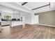 Open-concept living space with wood floors, modern lighting, and a stylish accent wall at 565 Kent Rd., Georgetown, SC 29440