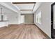Bright living room featuring wood beams, recessed lighting, neutral paint, and wood-look flooring at 565 Kent Rd., Georgetown, SC 29440