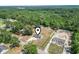 Aerial view of home with large yard surrounded by trees and a building at 568 Rosedale Dr., Aynor, SC 29511