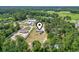 Aerial view of property showcases home, large yard, surrounding trees, and neighborhood at 568 Rosedale Dr., Aynor, SC 29511