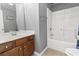 Bathroom featuring a vanity with wood cabinets and a shower-tub combo at 568 Rosedale Dr., Aynor, SC 29511