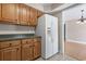 Kitchen cabinets, countertops, white refrigerator and open view to living room at 568 Rosedale Dr., Aynor, SC 29511