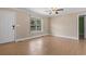 Bright living room with a large window offering natural light and wood-look flooring at 568 Rosedale Dr., Aynor, SC 29511