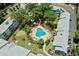 Aerial view of a pool and putt-putt golf surrounded by lush landscaping enhancing outdoor amenities at 5905 S Kings Hwy. # 242B, Myrtle Beach, SC 29575