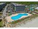 Resort aerial showcasing a large pool with oceanfront access, perfect for vacation and leisure at 5905 S Kings Hwy. # 242B, Myrtle Beach, SC 29575