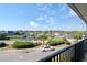 Relax on this balcony with views of waterway, palm trees and parking at 5905 S Kings Hwy. # 242B, Myrtle Beach, SC 29575