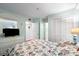 Bedroom with closet space, a seashell comforter, and a television at 5905 S Kings Hwy. # 242B, Myrtle Beach, SC 29575