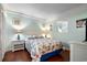 Cozy bedroom featuring a queen bed with seashell pattern bedding and wood flooring at 5905 S Kings Hwy. # 242B, Myrtle Beach, SC 29575