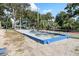 Outdoor bocce ball court with blue trim and green surroundings offering recreational enjoyment at 5905 S Kings Hwy. # 242B, Myrtle Beach, SC 29575