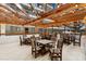 Outdoor seating area with wooden tables and chairs under a canopy at 5905 S Kings Hwy. # 242B, Myrtle Beach, SC 29575
