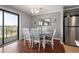 Charming dining area with a unique table and balcony access at 5905 S Kings Hwy. # 242B, Myrtle Beach, SC 29575