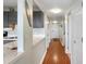 Bright condo hallway leading to the kitchen with white cabinets at 5905 S Kings Hwy. # 242B, Myrtle Beach, SC 29575