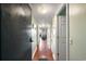Condo hallway with wood floors and view into the living room at 5905 S Kings Hwy. # 242B, Myrtle Beach, SC 29575