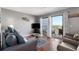Cozy living room with slider to balcony, comfortable seating and stylish decor at 5905 S Kings Hwy. # 242B, Myrtle Beach, SC 29575