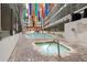 Indoor pool area with hot tub, colorful banners, and seating at 5905 S Kings Hwy. # 242B, Myrtle Beach, SC 29575