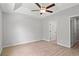 Bedroom featuring ceiling fan, plank floors, and ensuite bathroom at 600 Woodside Dr., Conway, SC 29526