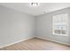 Bright bedroom featuring wood-look floors and a window for natural light at 600 Woodside Dr., Conway, SC 29526