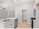 Modern kitchen island with stainless steel dishwasher, sink, and neutral color palette at 600 Woodside Dr., Conway, SC 29526
