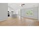 Bright open-concept living area with vinyl plank flooring, high ceilings, and access to kitchen at 600 Woodside Dr., Conway, SC 29526