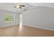 Inviting living room with large window, vaulted ceiling, and plank flooring at 600 Woodside Dr., Conway, SC 29526