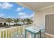 Balcony shows a blue patio table with seats and views of the community pool at 604 Heathrow Dr. # 1101, Myrtle Beach, SC 29579