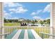Comfortable balcony seating with blue patio furniture and views of the community pool at 604 Heathrow Dr. # 1101, Myrtle Beach, SC 29579