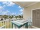 Balcony shows a blue patio table with seats and views of the community pool at 604 Heathrow Dr. # 1101, Myrtle Beach, SC 29579