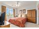 Bedroom with a ceiling fan, a large window with a view, and wood furniture at 604 Heathrow Dr. # 1101, Myrtle Beach, SC 29579