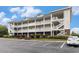 Multi-story condo building featuring brick accents and multiple balconies at 604 Heathrow Dr. # 1101, Myrtle Beach, SC 29579