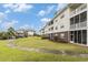Lush community green space with walking path to the condo buildings in the background at 604 Heathrow Dr. # 1101, Myrtle Beach, SC 29579