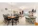 Spacious living room featuring dining area, with a ceiling fan and access to balcony at 604 Heathrow Dr. # 1101, Myrtle Beach, SC 29579