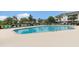 Inviting community swimming pool with plenty of lounge chairs and shade umbrellas at 604 Heathrow Dr. # 1101, Myrtle Beach, SC 29579