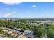 Wide aerial view showcases a coastal area with houses, trees, and a distant ocean skyline at 613B 3Rd Ave. S, North Myrtle Beach, SC 29582