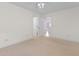 Bright bedroom featuring neutral carpet, a ceiling fan, and a door to another room at 613B 3Rd Ave. S, North Myrtle Beach, SC 29582