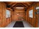 Spacious garage with windows, ample storage, and lighting, ideal for workshop or parking at 613B 3Rd Ave. S, North Myrtle Beach, SC 29582