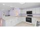 Modern kitchen with white cabinets and stainless steel appliances at 613B 3Rd Ave. S, North Myrtle Beach, SC 29582