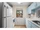 Functional kitchen featuring classic blue cabinets and appliances at 614 15Th Ave. S # 41, Surfside Beach, SC 29575