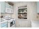 Well-lit kitchen area with vintage blue cabinets and modern appliances at 614 15Th Ave. S # 41, Surfside Beach, SC 29575