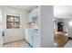 Bright kitchen with classic blue cabinets and a window with unique decor at 614 15Th Ave. S # 41, Surfside Beach, SC 29575