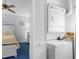 Bedroom area featuring a stacked washer and dryer, maximizing space and convenience in the property at 614 15Th Ave. S # 41, Surfside Beach, SC 29575
